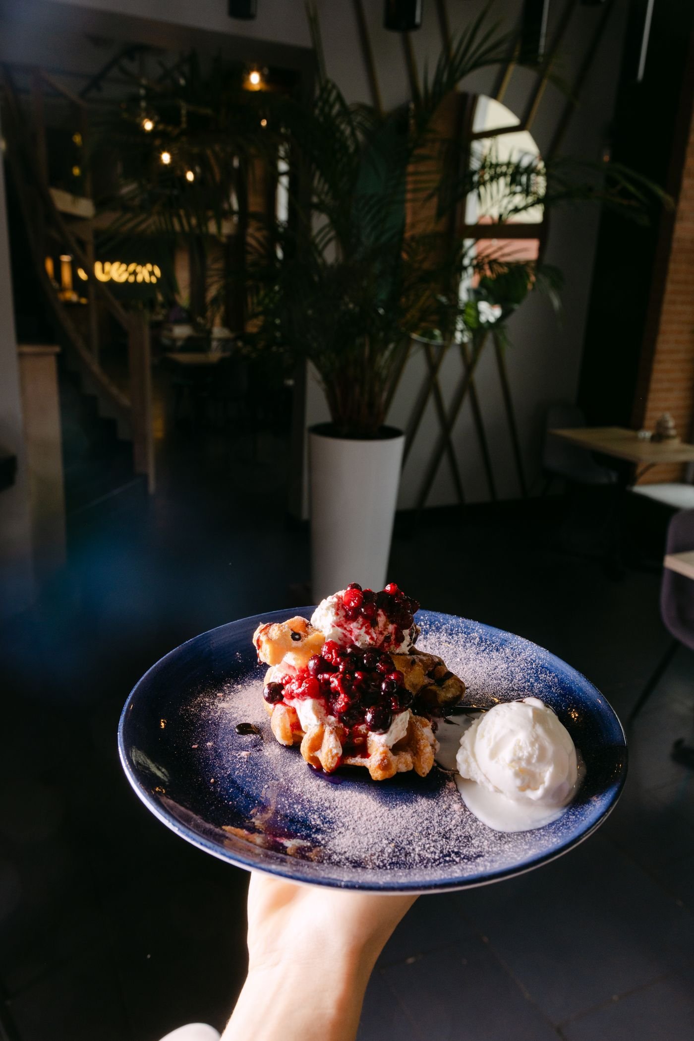 Waffle topped with berries and cream